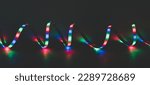 Small photo of LED strip with multicolored diodes on a dark background