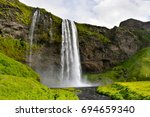 Skogafoss waterfall,The biggest waterfall in Skogar,Iceland Waterfall with green mountain.