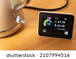 Small photo of Manchester UK. January 17, 2022. Smart meter display showing energy usage and electric kettle in process of boiling. Use so far today with gas exceeding budget.