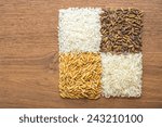 paddy rice,brown rice,white rice on wood background