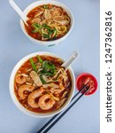 Small photo of Malaysian popular street food / Spicy Prawn Noodle Soup / Breakfast or lunch choice of many from street stalls to eating shops. Some like it hot and spicy while some prefers the milder taste