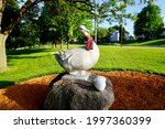 Small photo of New Ulm, Minnesota - 2021: Statue of Gertie the Goose in Riverside Park, a mascot for the Goosetown neighborhood in New Ulm, Minnesota. Goosetown was named for the geese the German immigrants kept.