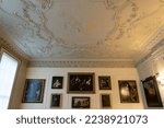 Small photo of Dublin, Ireland -2022: Dublin Castle Apollo Room in Viceregal State Apartments. (Irish: Caislean Bhaile Atha Cliath). Rococo plasterwork ceiling of Greek god of Apollo.