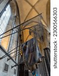 Small photo of Salisbury, Wiltshire, England -2023: Colors (flags) of the Wiltshire Regiment on display in Salisbury Cathedral. There are two colours per stand: the Sovereign’s Colour and Regimental Colours.