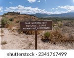 Take nothing but pictures... leave nothing but footprints. Sign at Tuzigoot National Monument reminds visitors of Leave No Trace ideology. 