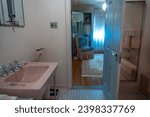 Small photo of Gettysburg, Pennsylvania -Aug 1, 2023: Eisenhower National Historic Site, home and farm of president Dwight D. Eisenhower. Mamie's en suite bathroom and dressing room with signature pink fixtures.
