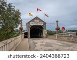 Small photo of Hartland, New Brunswick -Jun 1, 2023: The Hartland Covered Bridge is the world's longest covered bridge. It crosses the Saint John River from Hartland to Somerville, New Brunswick, Canada.