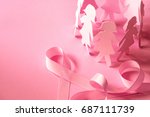 Small photo of Sweet pink ribbon shape with girl paper doll on pink background for Breast Cancer Awareness symbol to promote in october month campaign