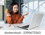 Small photo of Dissatisfied upset woman sitting at laptop inside office, businesswoman deluded disappointed and sad, holding bank credit card, received funds transfer error, refused online purchase.
