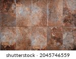 Rusty slate stone tiled wall texture or background