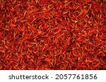 Small photo of Safflower (Carthamus tinctorius) also known as bastard saffron dry red flowers heap top view