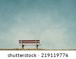 empty bench in an empty blue background 