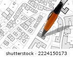 Small photo of Imaginary cadastral map with buildings, land parcel and vacant plot - land and property registry and real estate property concept illustration with pen