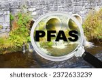 Small photo of PFAS Contamination - Alertness about dangerous PFAS per-and polyfluoroalkyl substances presence in polluted urban wastewater - Concept with magnifying glass