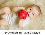 Newborn Baby Boy Playing With A ...