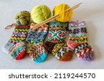 Small photo of handicraft concept, colorful knitted socks, knitting as a hobby, a good way to spend free time is handicrafts