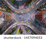Aerial view of cars and trains with intersection or junction with traffic, Taipei Downtown, Taiwan. Financial district and business area. Smart urban city technology.