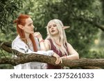 Small photo of An elf man and an elf woman are standing near a tree. A pair of stunning detailed elven fantasies, mythical fairy tale characters.