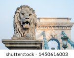 Statue of a lion. Lion statue at the bridgehead of the Széchenyi Chain Bridge in Budapest Hungary.