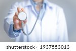 Small photo of Doctor holds his stethoscope to insinuate that it's time for a check up, professional emergency healthcare assistance service concept 