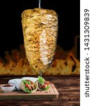 Small photo of Chicken shawarma sandwich Featured snippet from the web "Shawarma is a Levantine Arab meat preparation, where meat is placed on a spit and may be grilled for as long as a day. Shawarma can be served w