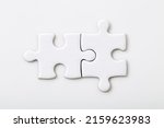 Two white blank puzzle pieces...