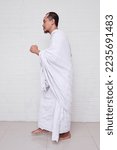 Small photo of Side view of muslim man performing Sa'i means walking back and forth or running between Safa and Marwa, a mandatory ritual in Hajj and Umrah