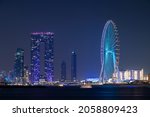 Small photo of Oct 15th,2021,Dubai ,UAE. Colorful view of the illuminated Address beach resort and the Dubai eye Ferris wheel captured from the palm Jumeirah west at Dubai, UAE.