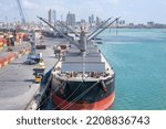 Small photo of Dar es Salaam, Tanzania - September 01: Dry cargo ship under load operation in port of Dar es Salaam on September 01, 2022 in Dar es Salaam, Tanzania.