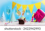 Small photo of Date of birth for woman or girl with birthday box. Pie with number of candles 97. Anniversary greeting card with champagne. Holiday decorations. Happy birthday