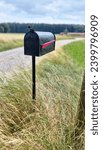 Small photo of Black mailbox on the wayside.