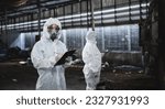 Workers wear protection suit...