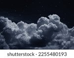 Small photo of Black dark blue night sky with stars. White cumulus clouds. Moonlight, starlight. Background for design. Astrology, astronomy, science fiction, fantasy, dream. Storm front. Dramatic.