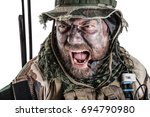 United States Commando face studio shot. Mouth opened, soldier yelling, emitting intiminate formidable frightening scream. Closeup portrait, cropped, isolated