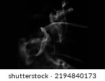 white abstract Smoke, steam, puffs over black background 