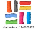Set of colorful rolled clothes isolated over white background