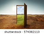 Open wooden door to the new world with green environment. Climate change concept.