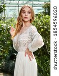 Small photo of Beautiful woman bride in long white wedding dress espousal fashion marriage celebration big day in green park garden backyard fiancee summer nature beautiful face blond hair makeup lady wife love.