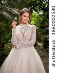 Small photo of Beautiful woman bride fashion model brunette hair bright makeup pretty wear long silk white dress with lace bridal ceremony wedding espousal in blooming romance garden party marriage happy big day.