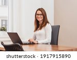 smiling business woman sitting... | Shutterstock . vector #1917915890