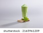 Small photo of Smoothies ice blended mixed fruits mango strawberry avocado with fresh fruits decoration on white background. Summer tropical Smoothies juice Drinks Smoothie mixer blending fruit