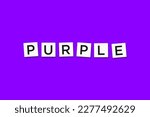 The word PURPLE, spelt with letter Scrabble tiles on a purple background
