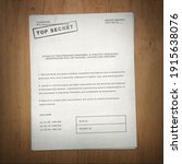 Small photo of top secret document on wooden desk background