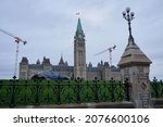 Small photo of OTTAWA, ONTARIO, CANADA - NOVEMBER 14, 2021: A Parliamentary Protective Service (PPS) car is parked in front of the Peace Tower and Centre Block on Parliament Hill.