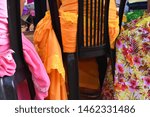 Small photo of A brilliant colour display of dress as a group of women gather together