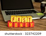 Wooden Blocks with the text: Fast Money