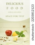 Small photo of Delicious Camembert cheese, on a light background. copy space. Abracadabra text