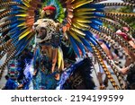 Small photo of Mexico City - August 17, 2022: People of indigenous descent dressed as Aztec Indians, dancing in the Zocalo of Mexico City