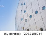 Small photo of Stockholm, Sweden 23 July, 2020 Facade detail of contemporary spherical building with circular windows or portholes shows a quirk architectural shape. Round modern structure conveys business concept