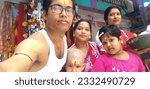 Small photo of Budge Budge, West Bengal, India- July 12 2023: Family at Temple of Lord Shiva, worship at temple